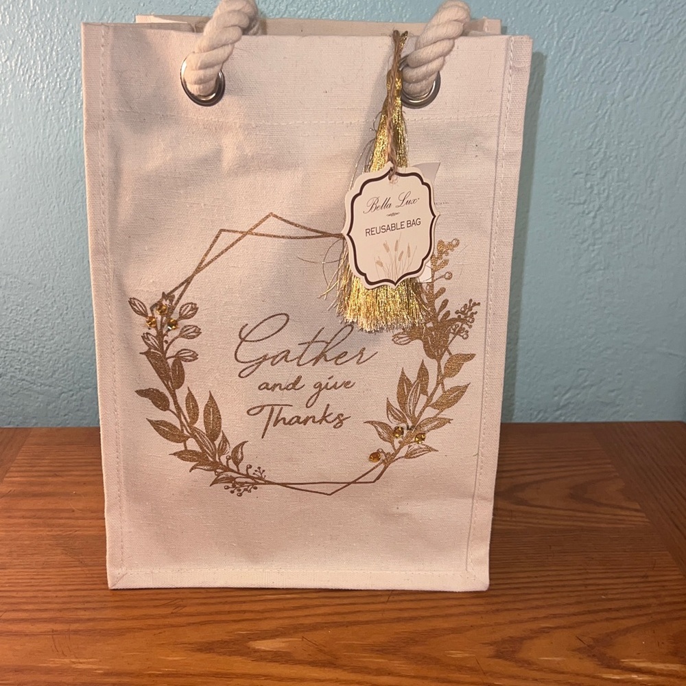 Cream colored canvas reusable bag, “Gather and give Thanks” written on side NWT